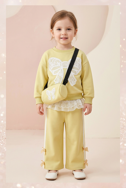 Three-year-old girl wearing the yellow lace-bow set
