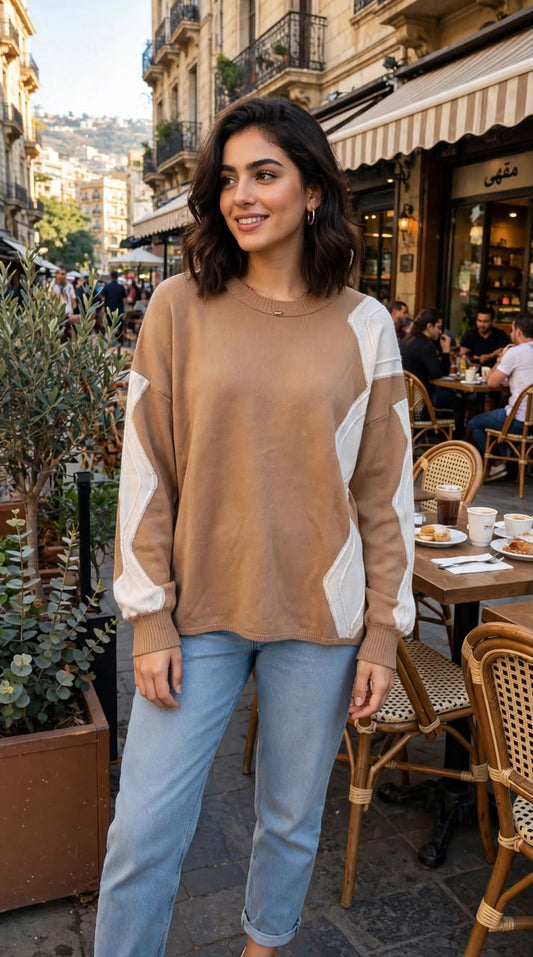 A stylish tan or camel-colored knit sweater