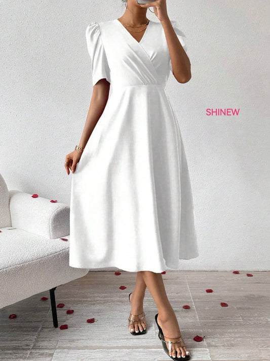 Elegant, midi-length white dress